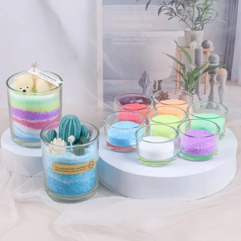 multiple colorful candle waxes inside multiple jars